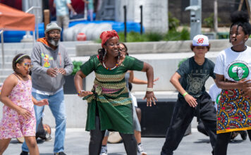 Juneteenth arrives this Monday. Here are some upcoming celebrations open to all. Adults and children dancing in a courtyard