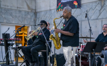 Music shapes SLCC’s Juneteenth celebration Clifton Sanders standing in foreground and playing a saxophone