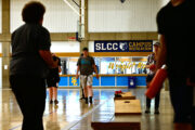 Trans Sports Ball Day serves as a space for all to exercise, have fun Several people playing cornhole in a gymnasium