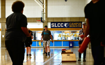 Trans Sports Ball Day serves as a space for all to exercise, have fun Several people playing cornhole in a gymnasium