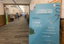 Free flu shots for Bruins this October Center for Health and Counseling poster on display in a hallway