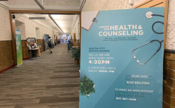 Free flu shots for Bruins this October Center for Health and Counseling poster on display in a hallway