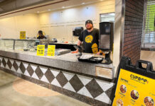After café closures, SLCC explores visiting restaurant concept Cupbop employee taking orders inside Redwood Student Center