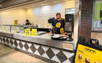 After café closures, SLCC explores visiting restaurant concept Cupbop employee taking orders inside Redwood Student Center