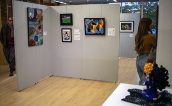 New ‘La Mortalidad’ exhibit focuses on life and its end Multiple art pieces hanging in a gallery