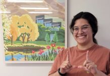 Eats with Emily: Easing the higher ed transfer process Emily Hernandez Alzamora making a "U" hand gesture