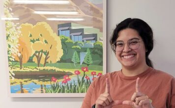 Eats with Emily: Easing the higher ed transfer process Emily Hernandez Alzamora making a "U" hand gesture