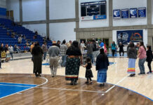 SLCC’s 2023 Round Dance celebrates the college’s Native community People dance around the center of a basketball arena