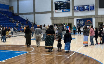 SLCC’s 2023 Round Dance celebrates the college’s Native community People dance around the center of a basketball arena