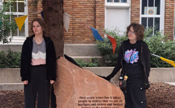SLCC celebrates Transgender Day of Remembrance with unveiling of stone monument Two students standing beside a stone monument in South City Campus courtyard