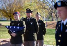 Photos: 2023 Veterans Day flag ceremony Cadets walk in formation with American flag