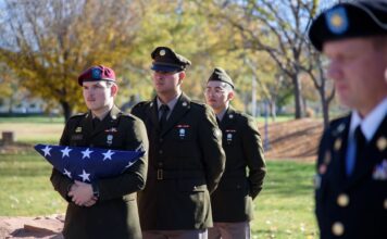 Photos: 2023 Veterans Day flag ceremony Cadets walk in formation with American flag
