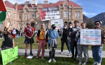 Rally in Provo expresses support for Palestine amid ongoing conflict Multiple people standing outside Provo Library with pro-Palestinian signs