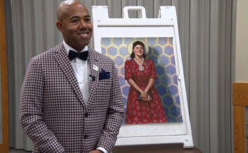 SLCC event remembers Henrietta Lacks, tells the importance of owning one’s story Dr. Richard Ferguson poses in front of a photo of Henrietta Lacks
