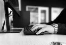 With a lack of diversity in tech, SLCC shows signs of progress Grayscale image of a student typing on a keyboard