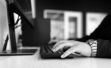 With a lack of diversity in tech, SLCC shows signs of progress Grayscale image of a student typing on a keyboard