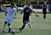 Sports recap: SLCC men’s soccer won regional but fell short of NJCAA title Two opposing soccer players compete for control of the ball