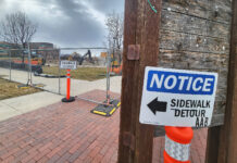 Students can expect a new plaza area at the Redwood campus this fall An orange barricade with "Notice, sidewalk closed" sign next to a construction site