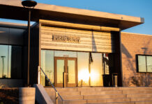 Bridging the gap between people of color on campus and armed University of Utah police Evening sun shining off a window in front of the U. public safety building