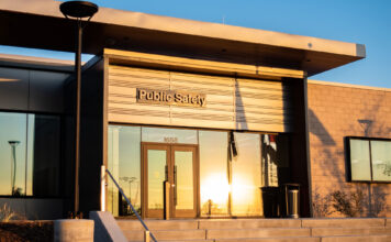 Bridging the gap between people of color on campus and armed University of Utah police Evening sun shining off a window in front of the U. public safety building
