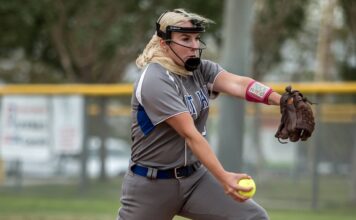 Early into the new season, Bruins softball swings for the fences Tiffany Hermansen winds up to throw a softball