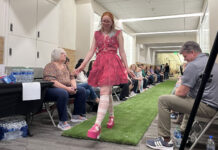 SLCC ‘Trashion Show’ showcases sustainable fashion for Earth Day Model wearing a pink upcycled dress while walking a grass catwalk