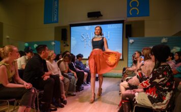 SLCC Fashion Club seeks models for Senior Fashion Show Model walking the catwalk while wearing a student's design