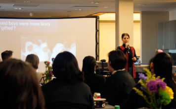 Asst. professor shares her ‘steminism’ story for SLCC event tackling STEM gender gap Dalia Salloum stands in front of audience while giving a presentation