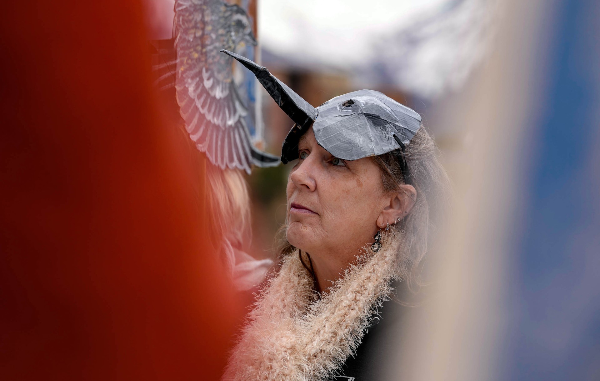 Rally attendee wearing a phalarope headpiece