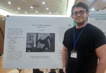 3rd undergrad research conference continues in highlighting student work Zach standing next to his research poster