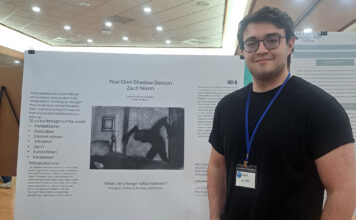 3rd undergrad research conference continues in highlighting student work Zach standing next to his research poster