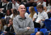 SLCC men’s basketball head coach Kyle Taylor leaves after five record-breaking years Coach Kyle Taylor smiling with arms crossed