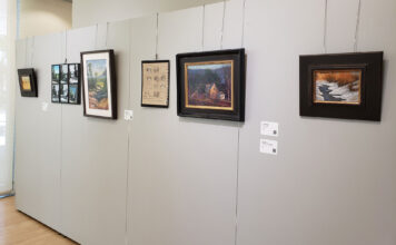 ‘The Landscape En Plein Air!’ exhibition showcases SLCC student art A row of paintings displayed on a wall in a gallery