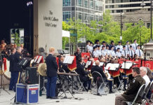 Armed Forces Day concert pays homage to local service men and women Band and choir playing music on outdoor plaza