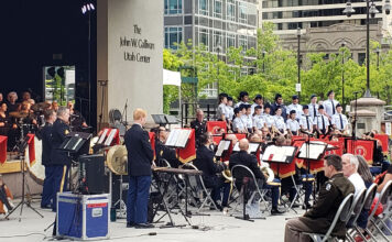 Armed Forces Day concert pays homage to local service men and women Band and choir playing music on outdoor plaza