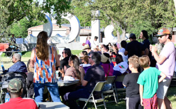 SLCC hosts third annual Juneteenth music festival Crowd of festivalgoers applauding a concert performance