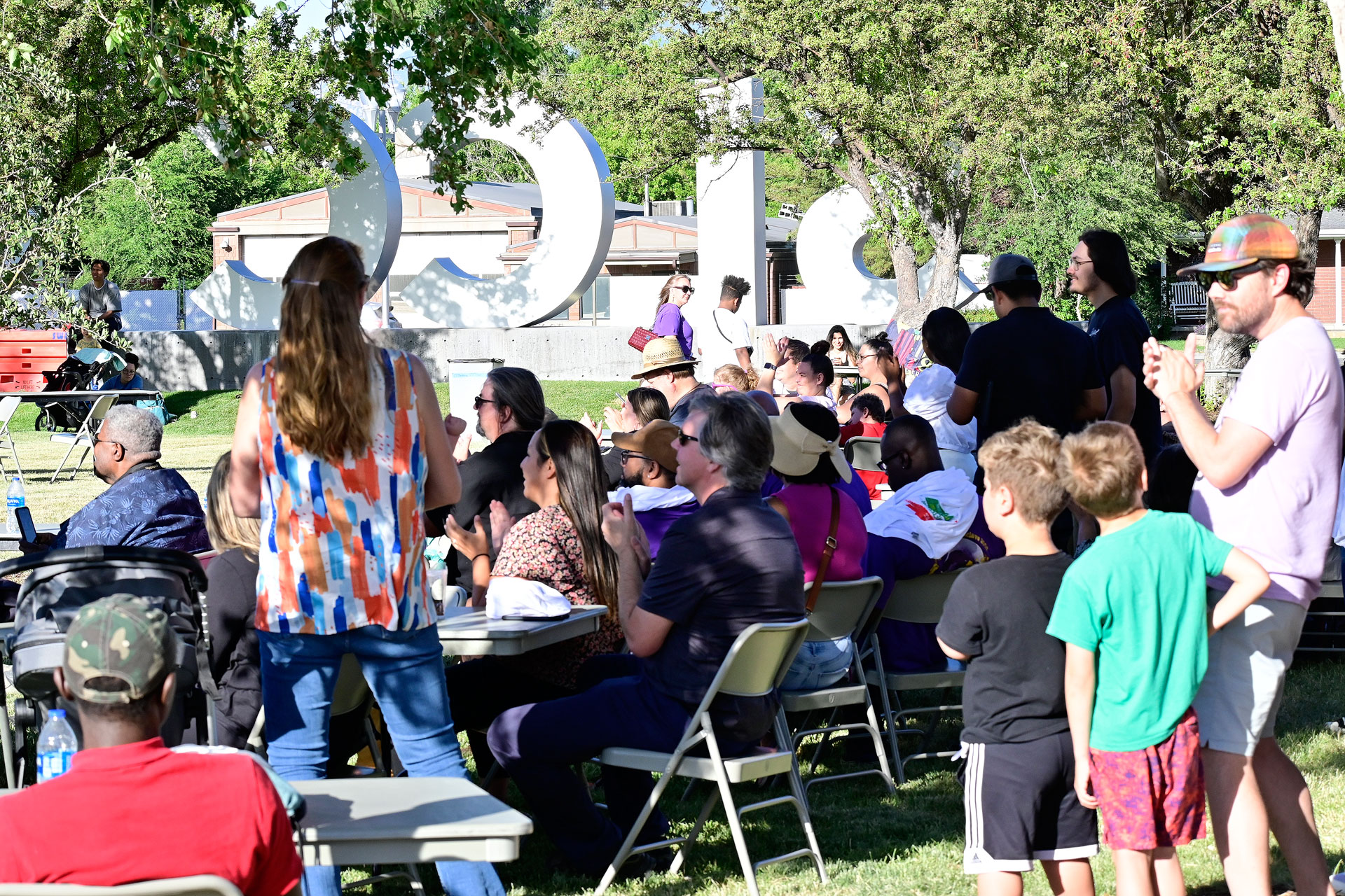 Crowd of festivalgoers applauding a concert performance