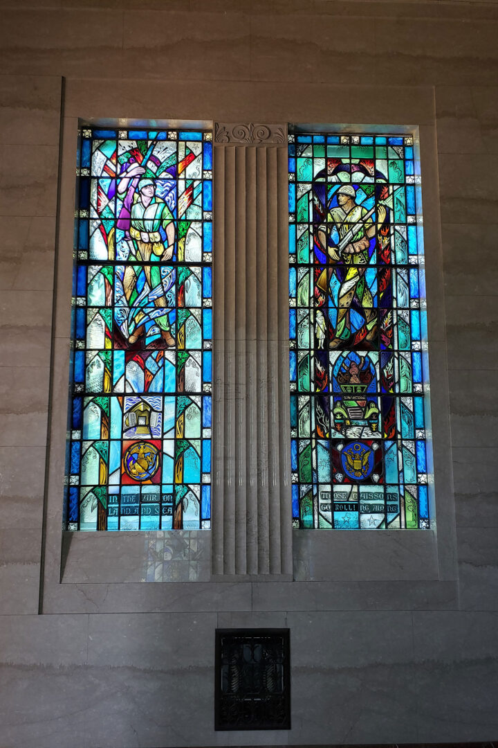 Two multicolored stained glass windows in a chapel
