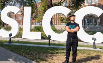 SLCC Hometowns: Bao Lam Bao Lam standing in front of SLCC block letters
