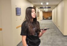 Salt Lake Community College students share their thoughts on upcoming 2024 election Stephanie holding a recorder while answering questions