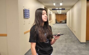Salt Lake Community College students share their thoughts on upcoming 2024 election Stephanie holding a recorder while answering questions