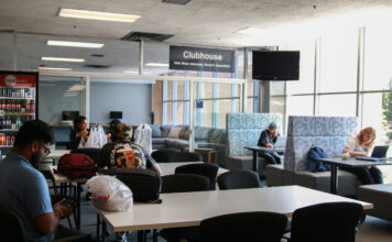 HB 261 changes the campus at Utah State University, students react Students sitting at tables near USUSA clubhouse