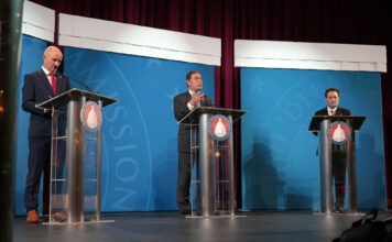 Utah’s fiery 2024 gubernatorial debate Spencer Cox, left, Brian King, center, and Robert Latham standing at debate podiums