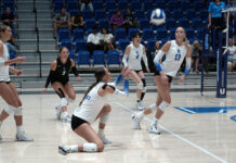 SLCC volleyball emerges victorious in early season tournament Volleyball players returning a serve