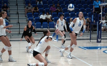 SLCC volleyball emerges victorious in early season tournament Volleyball players returning a serve