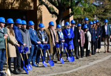 Groundbreaking: A new business building is coming to SLCC A row of dignitaries wearing blue hard hats and holding blue shovels