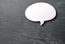 Op-ed: Writing as a form of expression and a tool White speech bubble on a silver background