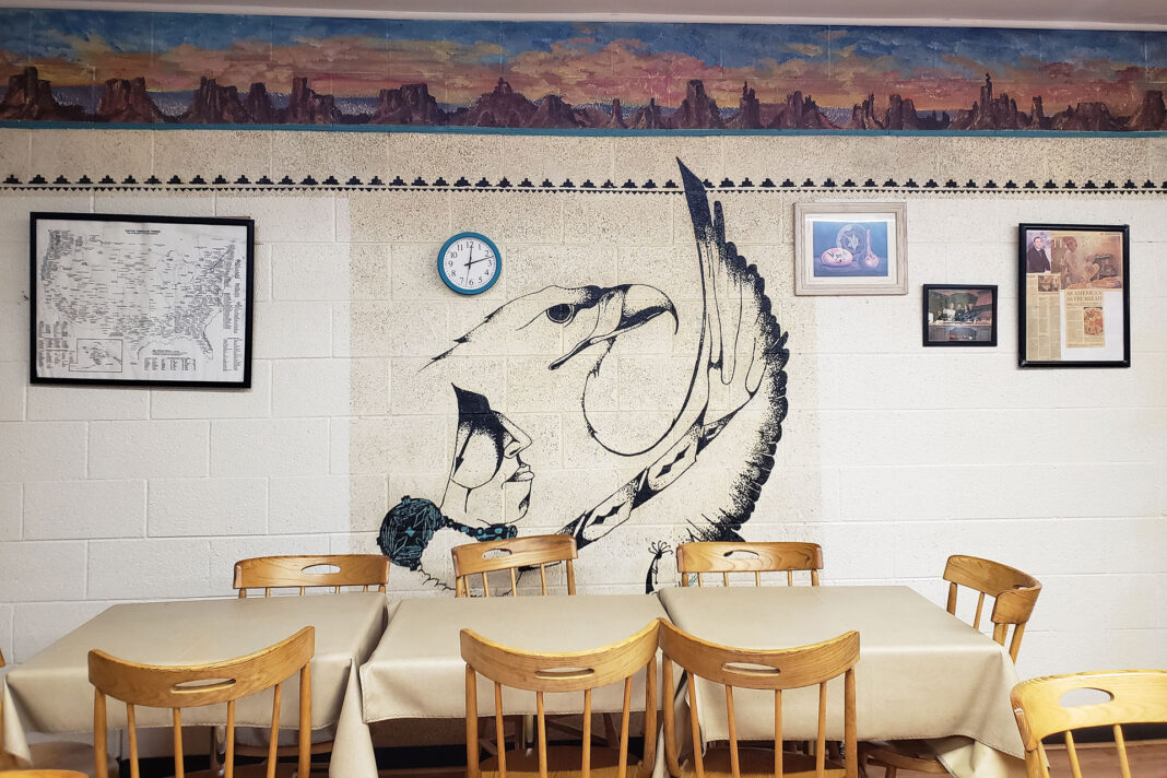 Interior wall painted with a desert landscape and eagle mural