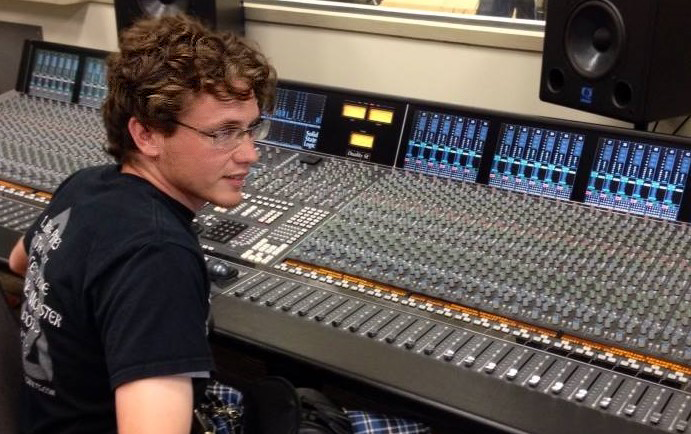 Michael Fewkes sitting at a sound board