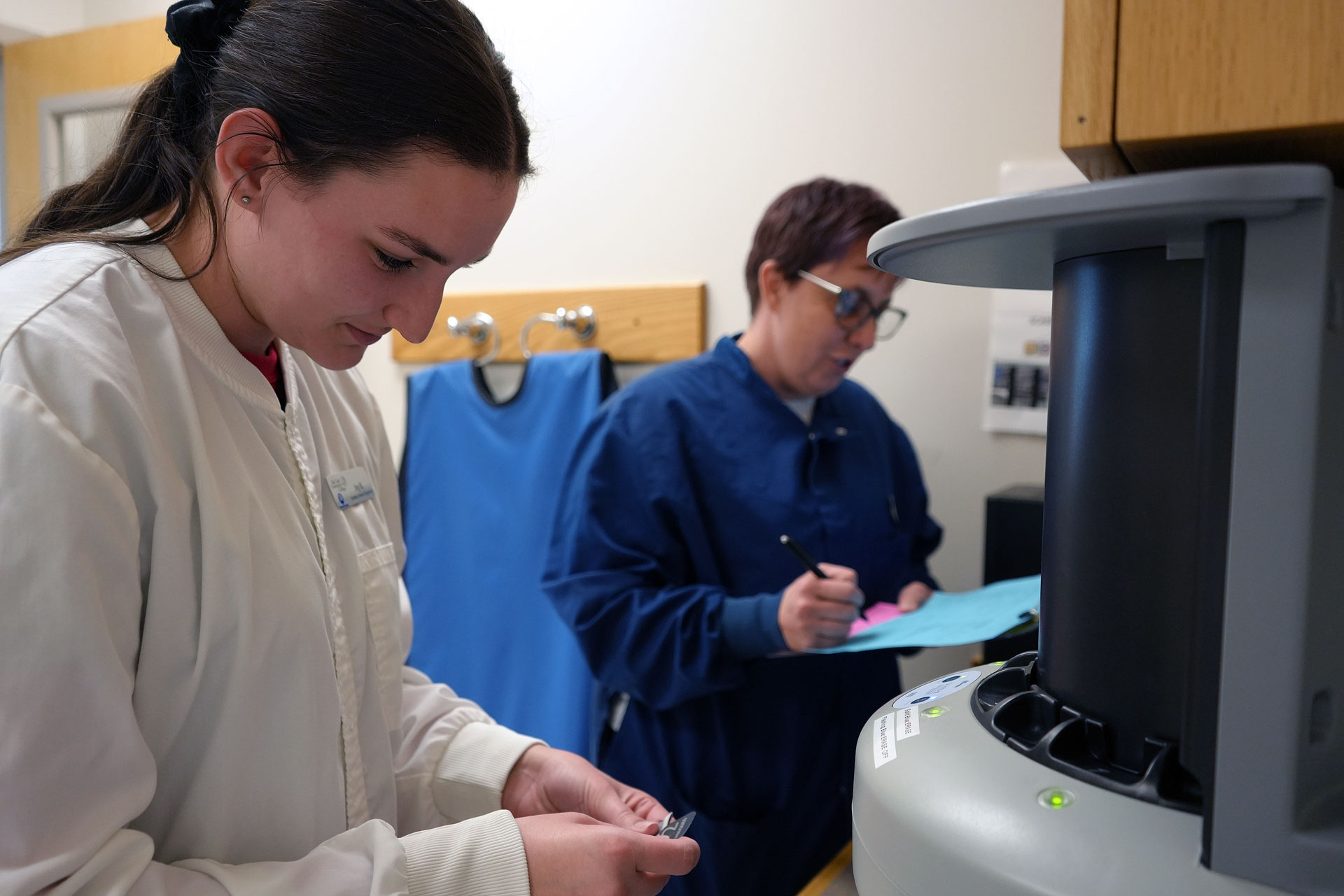 Dental hygiene student and instructor working in the clinic
